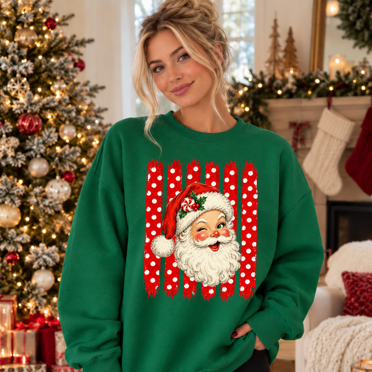 A woman wearing a festive green crewneck sweatshirt with a large graphic of Santa Claus in front of red-and-white polka dot vertical stripes.