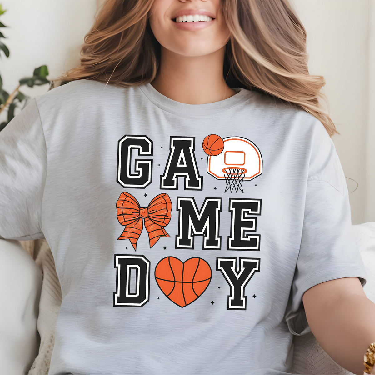 Gray shirt with GAME DAY lettering decorated with orange basketballs and black basketball-themed details.