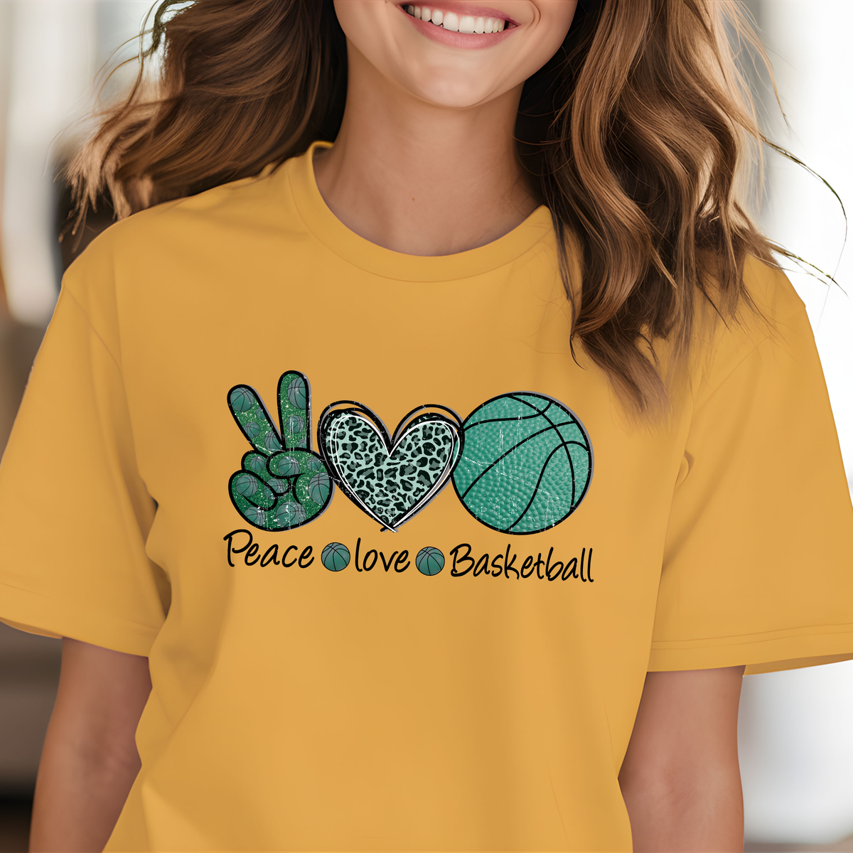 Golden yellow shirt featuring peace, love, and basketball graphics in teal, green, and black.