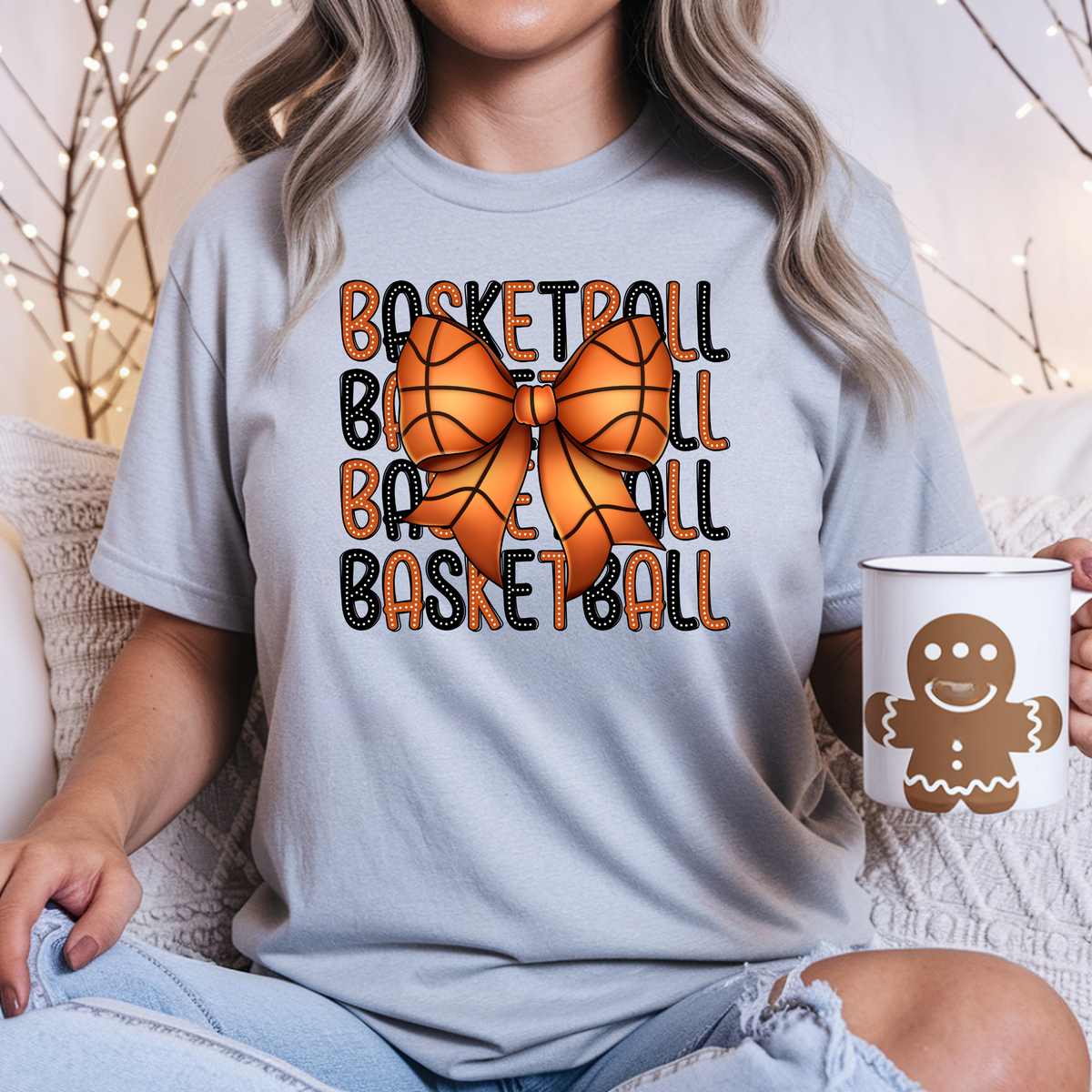 Gray shirt featuring repeated basketball and baseball lettering in orange and black with a small basketball graphic.