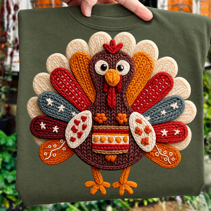 A military green crewneck sweatshirt featuring a large, colorful, faux embroidered turkey design on the front.