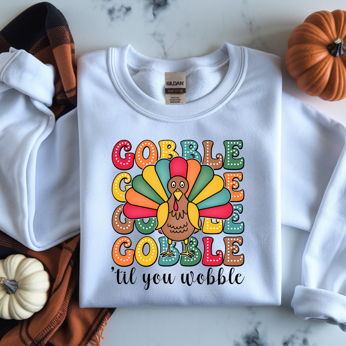 Colorful retro Gobble Gobble Gobble lettering with a bright Thanksgiving turkey illustration.