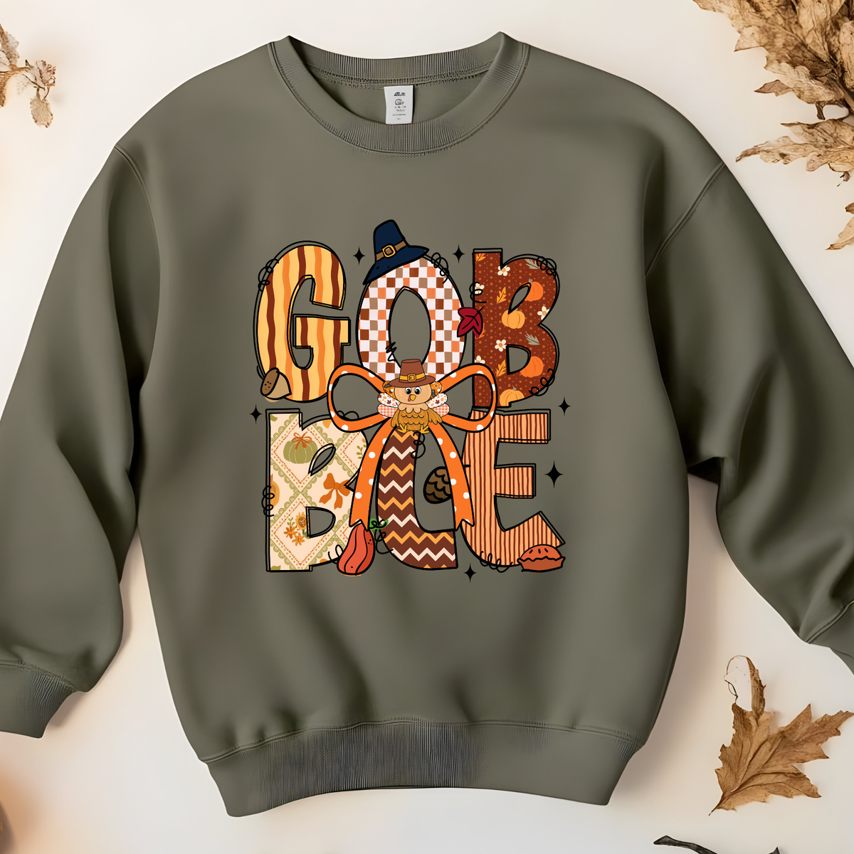 Retro patterned GOBBLE lettering in orange, cream, and autumn colors.