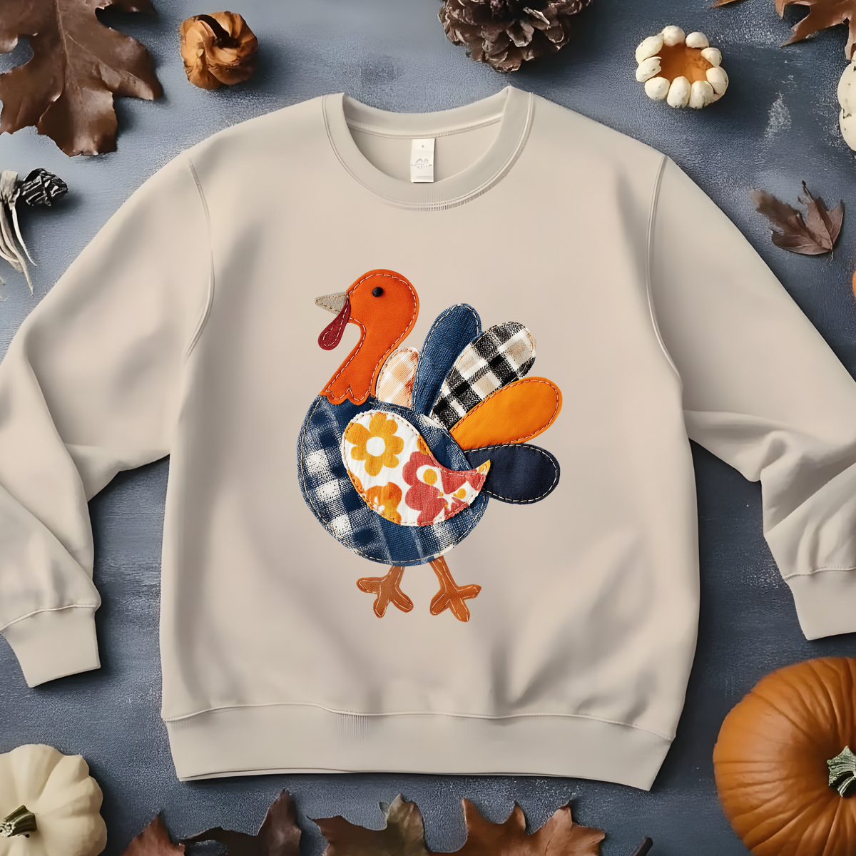 Cute Thanksgiving turkey illustration with colorful patchwork feathers in blue, orange, and yellow.
