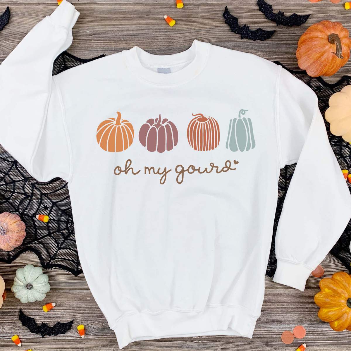 Oh My Gourd lettering with small pumpkins in muted orange, green, and neutral colors.