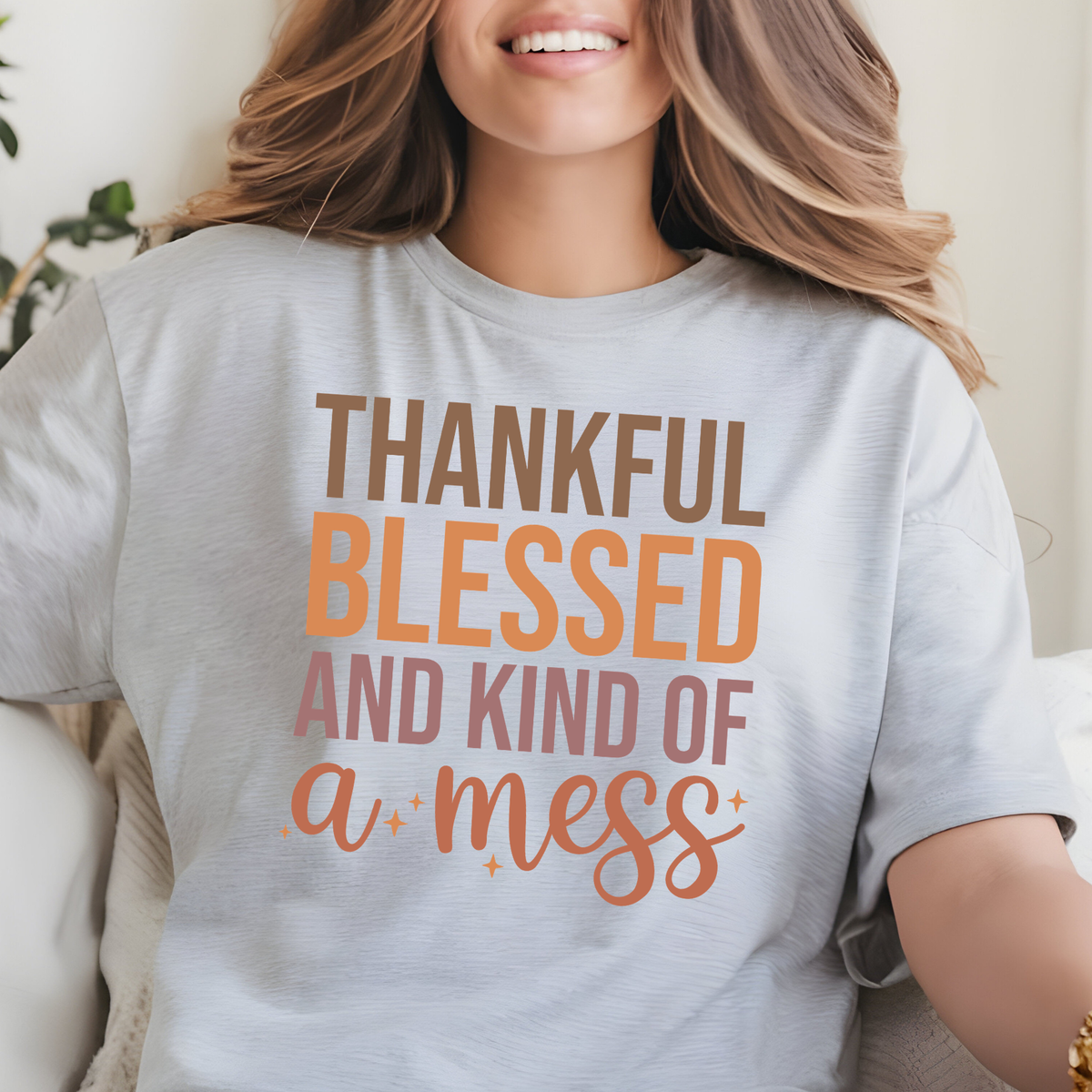 Thankful Blessed and Kind of a Mess phrase in large orange and white lettering.