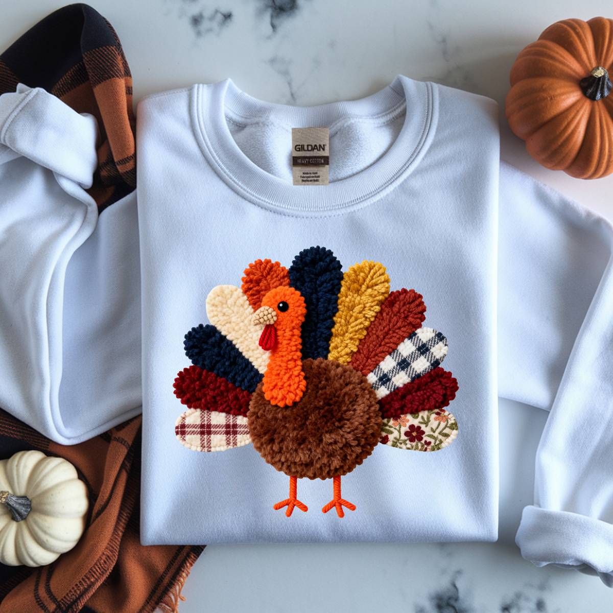 Cute turkey with textured brown body and colorful crocheted-style feathers in autumn colors.
