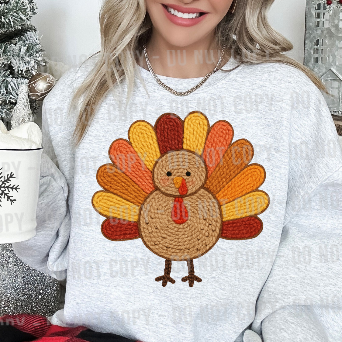 Cute Thanksgiving turkey with textured faux crochet feathers in orange, yellow, and brown.