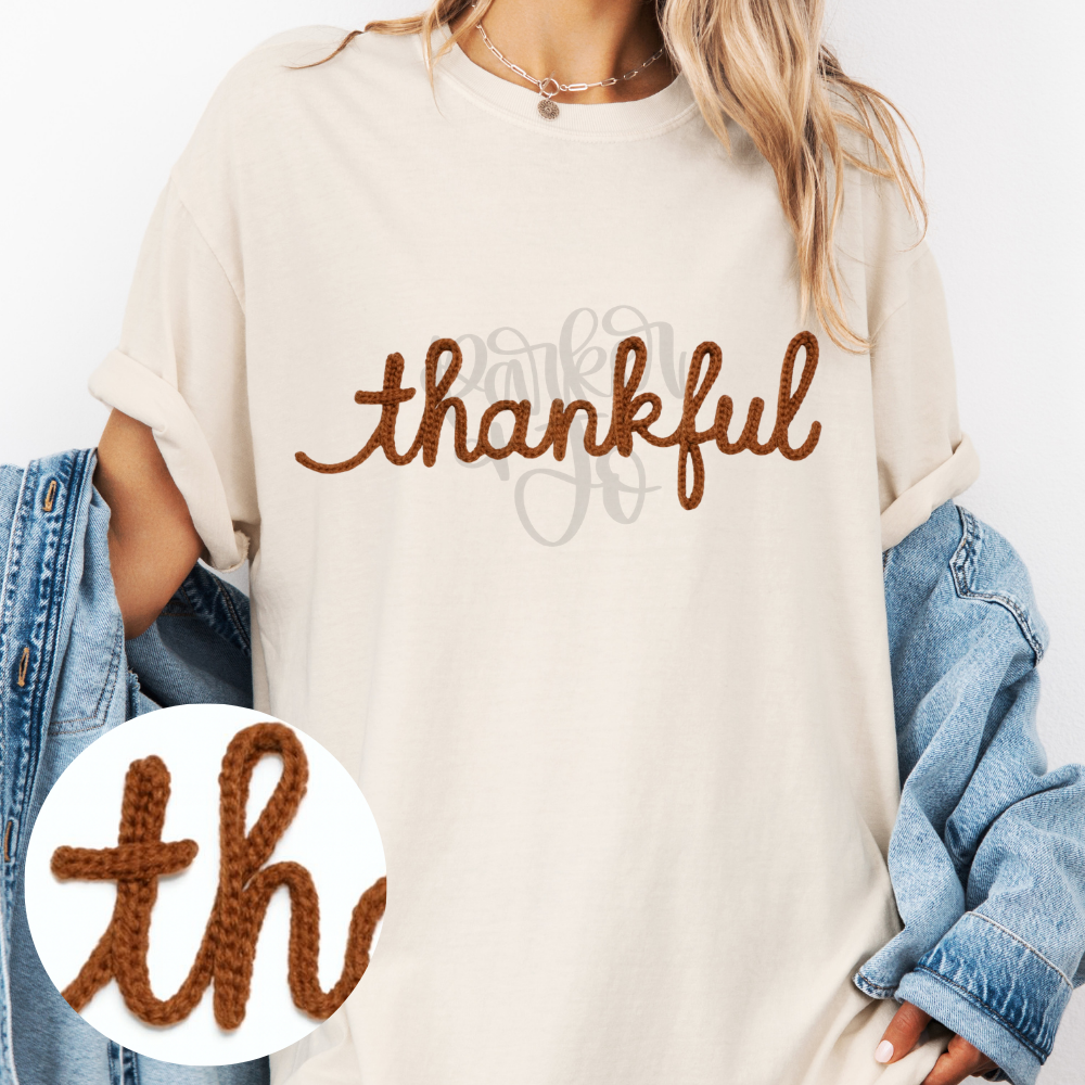 Minimalist brown thankful lettering in a handwritten script style.